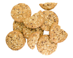 Cereal cookies with seeds and nuts close up isolated on a white background. Healthy food, gluten free diet