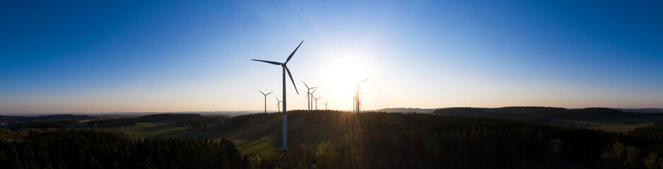 wind wheels in an evening sundown high definition panorama
