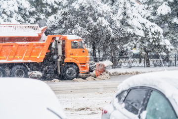 Snowplow cleans the road from snow