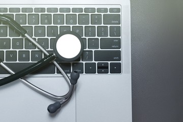 Stethoscope on laptop computer, medical technology backgrounds concepts