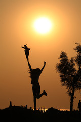 silhouette of a woman jumping