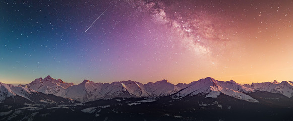 Snowy rocky mountain with a beautiful starry night, space fort text
