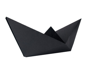 Origami black paper boat isolated on white background