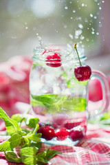 Refreshing cocktail with cherry and mint