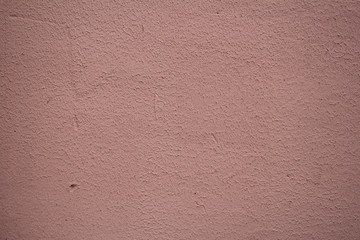 Fototapeta premium Crack of plastered pink wall background texture.