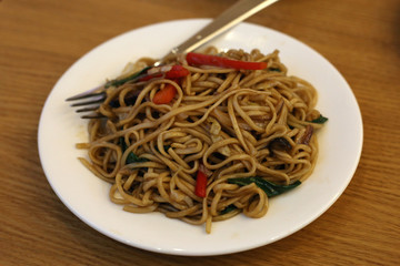 Fried noodles with vegetables served in Din Tai Fung restaurant of Mall of the Emirates in Dubai UAE, December 2019. Healthy, delicious and fresh asian food offering good value for money.