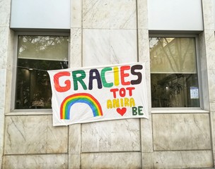 Sign during the quarantine in coronavirus crisis with the rainbow and  Text in catalan: Thanks, Everything will be allright.