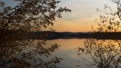 The last sun rays on a mountain lake