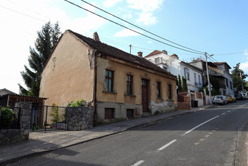 Fototapeta na wymiar Family houses in Zagreb, damaged after strong earthquake that hit the city. House in picture suffered damage on the facade, roof and both of the chimneys were completely or partly broken off