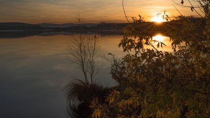 Sunset on an autumn evening on a lake