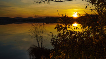 Sunset on an autumn evening on a lake