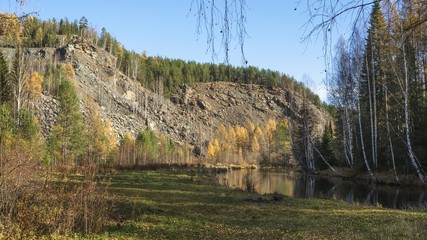 View of the river and mountains in the autumn forest