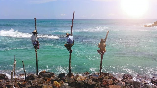 Merissa,Sri Lanka, on the local beach: The three fishermen on the ocean