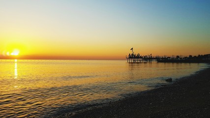 Obraz na płótnie Canvas Scenic View Of Sea Against Romantic Sky At Sunset