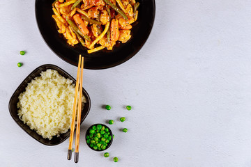 Stir fry vegetables with chicken and rice.