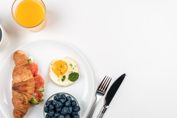European Breakfast with croissants and salmon on a white background.