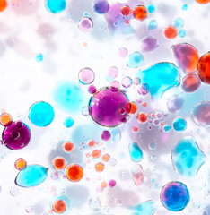 Planet Looking Bubbles of Coloured Water on Oil Fantasy Background