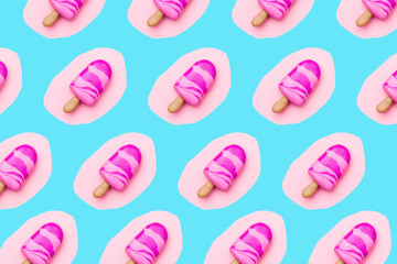Trendy sunlight Summer pattern made with pink ice cream on bright light blue background. Minimal summer food concept. Flat lay.
