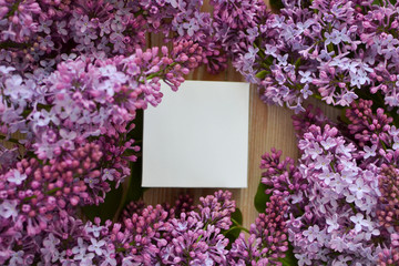 white jewelry box. Spring gift. Lilac . White box on a lilac background. Gift wrapping. Gift for women