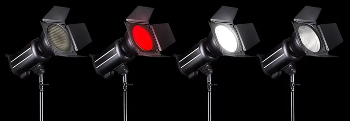 Fotobehang Set of studio flash lights isolated on black background with lamp. © boule1301