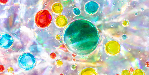 Planet Looking Bubbles of Coloured Water on Oil Fantasy Background