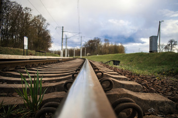 railway with rails and sleepers close-up on the background of nature