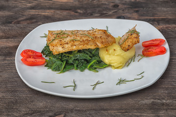 Fish hake spinach potatoes cherry