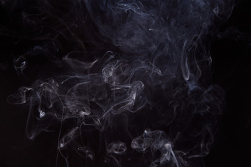 Smoke fragments on a black background
