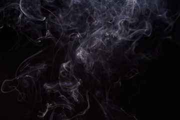 Smoke fragments on a black background