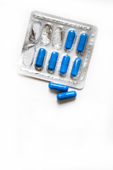 Medicine in capsules on a white background