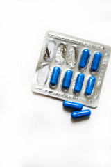 Medicine in capsules on a white background