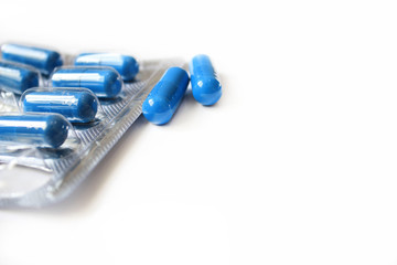 Medicine in capsules on a white background