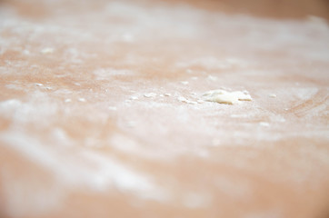 Flour on the table. Small lumps of dough on the table. Cocaine like  flour