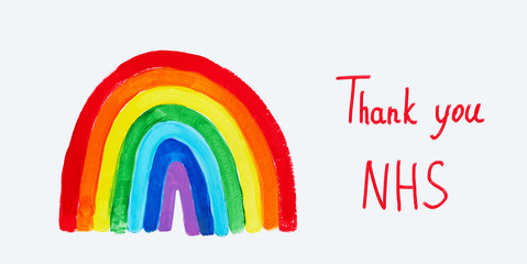 Thank to NHS lettering. Childrens hand drawing rainbow on paper. Greating card for nurses.