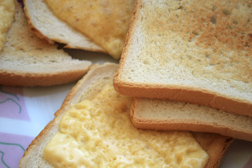 Several pieces of bread with cheese