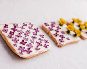 3 sandwiches with yellow and pink flowers