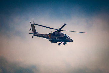 Fototapeta na wymiar Israeli Air Force, Apache helicopter fly above the ocean 