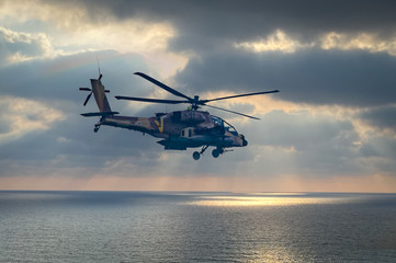 IDF, Israeli Air Force,  Apache helicopter fly above  the ocean 