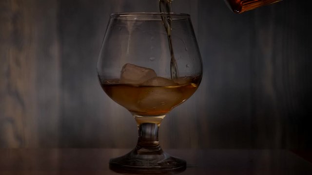 Pouring some brandy into a glass