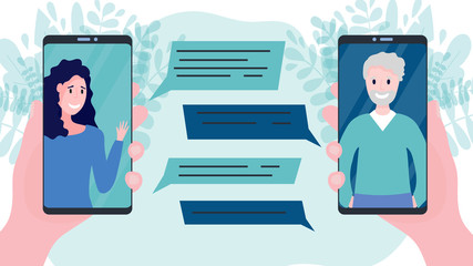 Two hands holding smart phones or cellular phones with video call between happy woman and her father or grandfather with speech bubbles. Concept of online communication with friends, relatives