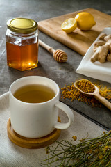 Obraz na płótnie Canvas Materials to prepare ginger tea with honey and pollen