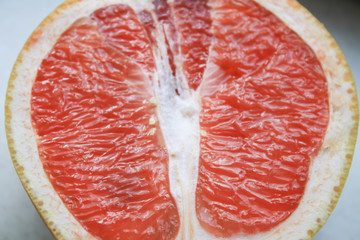 Sliced grapefruit on a light background