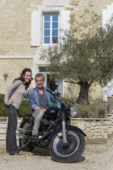 Naklejka na ściany i meble husband introduces his new custom motorcycle to his wife