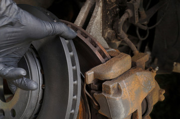 Brake replacement. Comparison of worn and new brake disc.