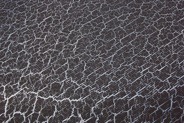 texture of dark paint with the effect of cracking coating