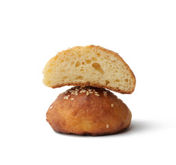 baked round bun with sesame seeds isolated on a white background