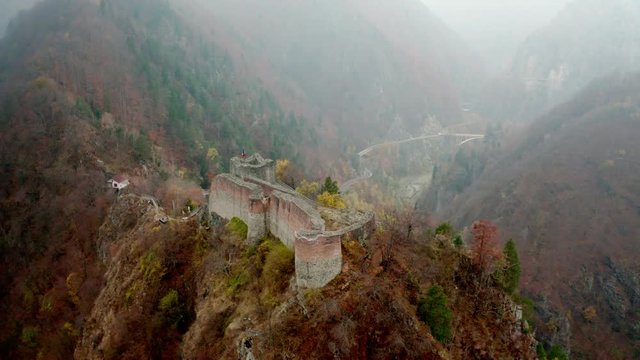 Poenari Citadel in Romania surrounded by autumn nature