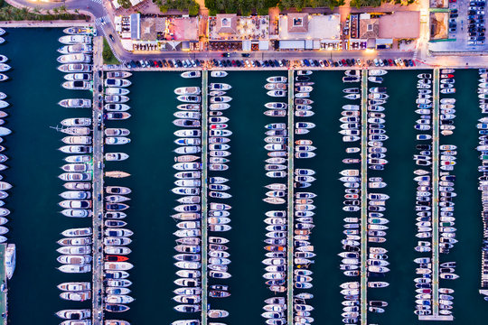 Spain, Balearic Islands, Mallorca, Portals Nous, Puerto Portals, Aerial view of luxury marina at sunset