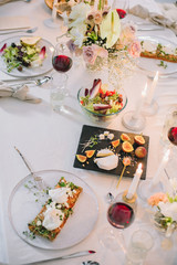 holiday table with a floral bouquet and food