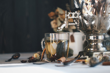 Tula samovar with tea, bagels and flowers